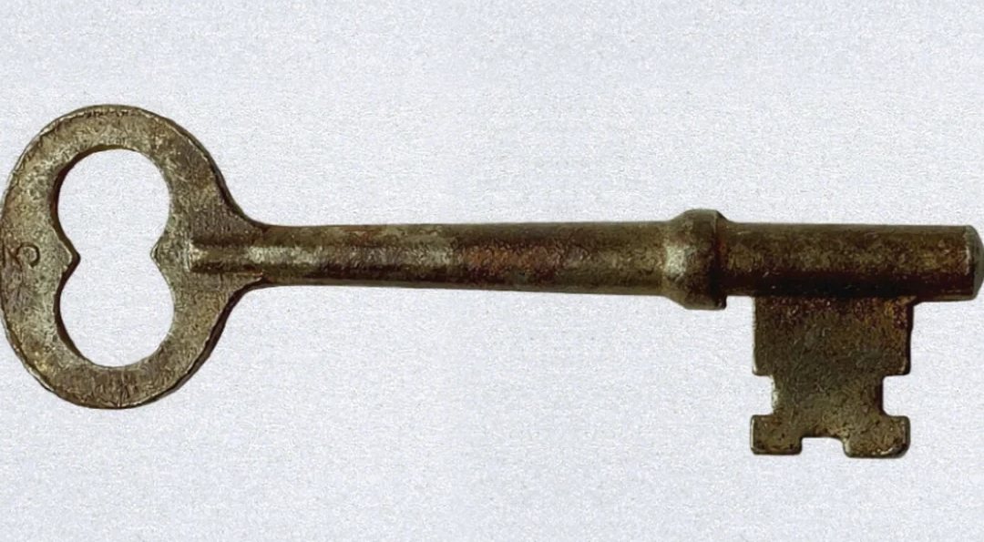 An antique brass house key